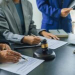 Business lawyer team working with law firms contracts in working room.